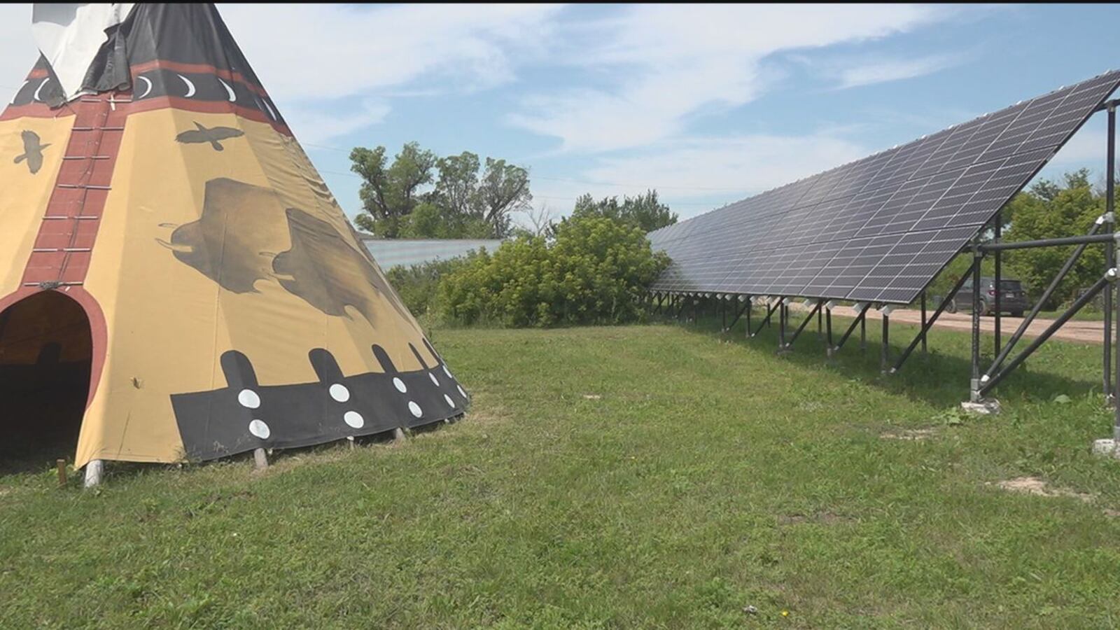 Photo of Tipi and Solar Panels on a grassy field